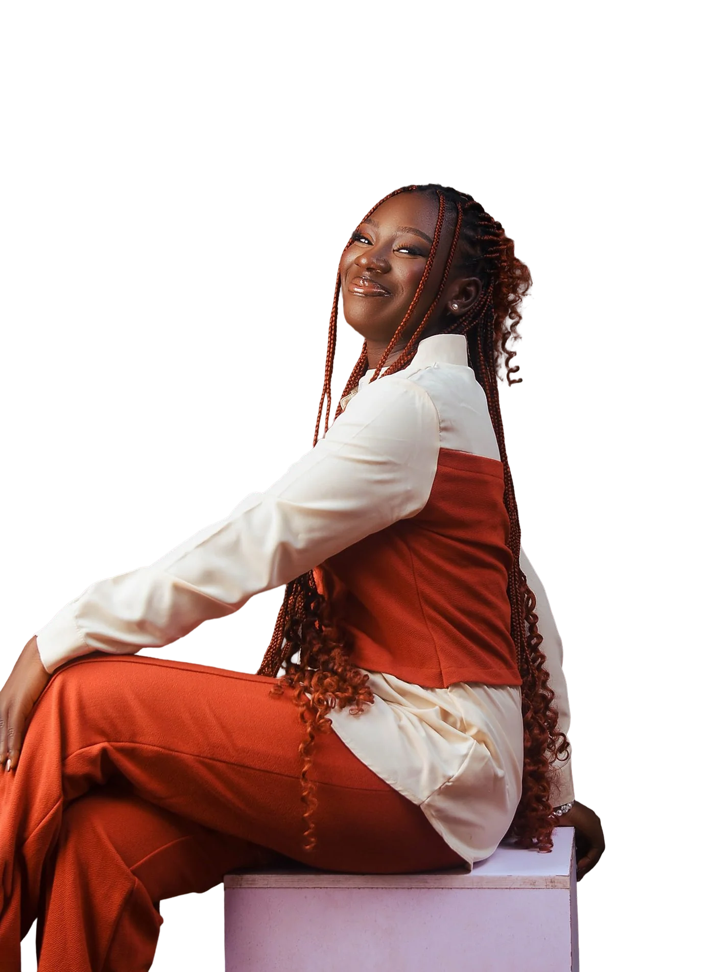 Anjolaoluwa Akinosun, seated and smiling