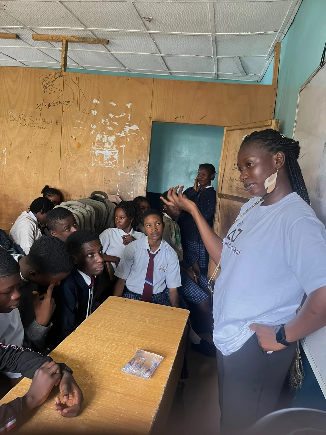 Anjola talking with a class of secondary school students